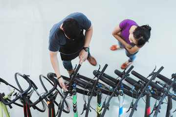 Bicycle salesman Helping customers buy a bike in a shop.top view © torwaiphoto