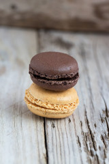 Beautiful homemade macaroons on wooden table. Natural light, selective focus. 