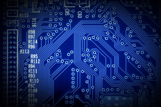 Modern microchip technology background of a printed circuit board, or PCB