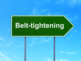 Finance concept: Belt-tightening on road sign background