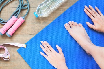 Hands and foot yoga position with sport equipments, Healthy lifestyle and work out at home