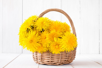 Wicker basket full of yellow sow-thistles