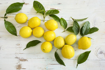 Pile of lemons on wooden table