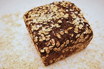 Fresh black bread on white background 