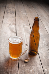 glass beer on wood background