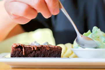 Delicious ice rainbow, brownie, cake, vanilla cream and banana in holiday.