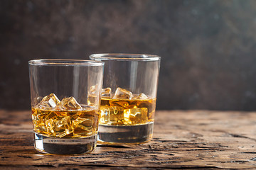 Whiskey with ice in glasses