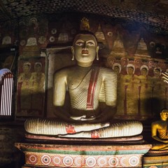 Sculptures of Buddha inside the Dambulla Cave Temple also known as the Golden Temple of Dambulla, Sri Lanka