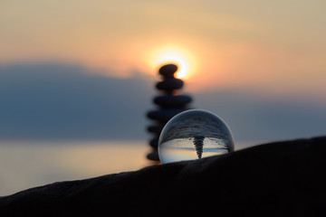 Stones and crystal ball in evening