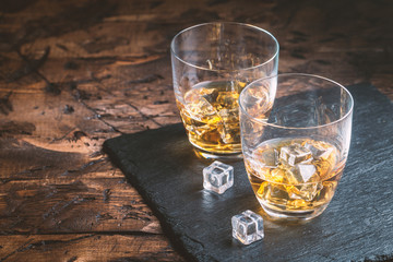 Whiskey with ice in glasses