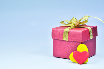 Gift Box and colorful heart on white background