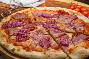 Pizza on a wooden background