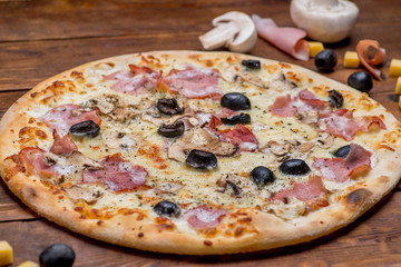 Pizza on a wooden background