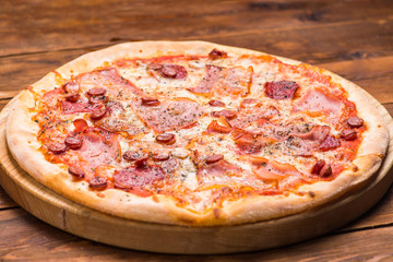 Pizza on a wooden background