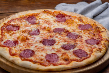 Pizza on a wooden background
