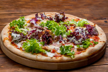 Pizza on a wooden background