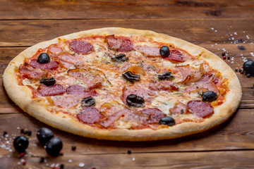 Pizza on a wooden background