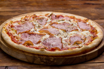 Pizza on a wooden background