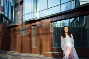 Fashionable woman posing outside