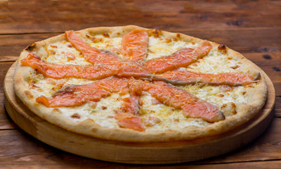 Pizza on a wooden background