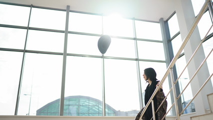 Woman inside of glass building