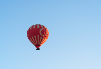Hot air balloon flying over valley. Cappadocia. Turkey