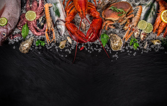 Fresh tasty seafood served on old wooden table.