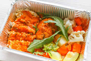 Healthy food in foil boxes, diet concept.