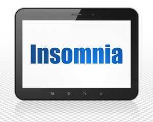 Medicine concept: Tablet Pc Computer with Insomnia on display
