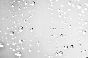 raindrops on window glass abstract background