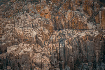 Stone mountain cliff texture background.
