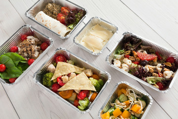 Healthy food take away, top view at wood background