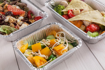 Healthy food take away, top view at wood background