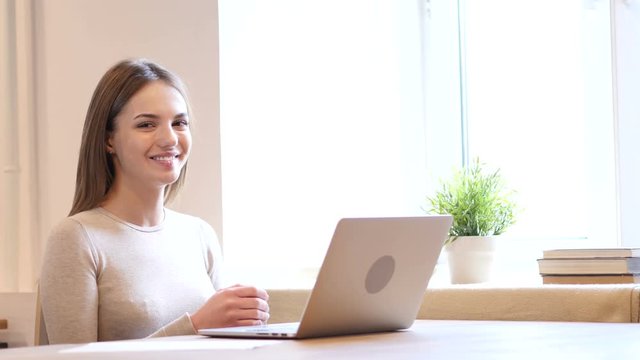 Smiling Young Female Designer at Work