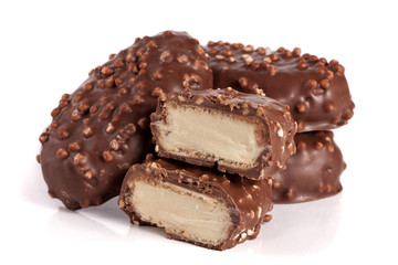 chocolate candy with white cream filling isolated on white background