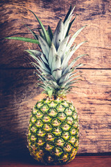 pineapple on wooden background 