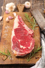 raw beef on wooden board