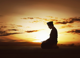 Young asian muslim man worshiped praying to god