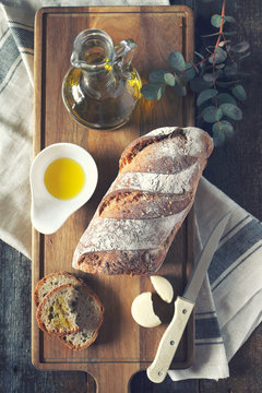  French country bread, round cheese and olive oil. Toned image