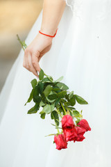 Sweet Wedding Bouquet in the Hands of the Bride