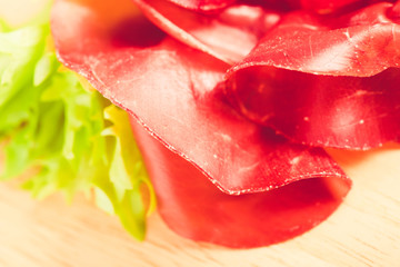 italian bresaola prosciutto -typical food made of cow meat of the Valtellina Lombardia Italy
