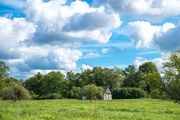 Small country farmhouse out on the field. Dobele, Latvia.