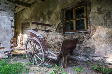Fototapeta na wymiar Old broken wooden wagon. Igates Pils, Latvia