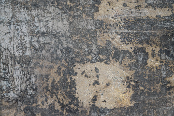 Cracking and peeling paint on a wall
