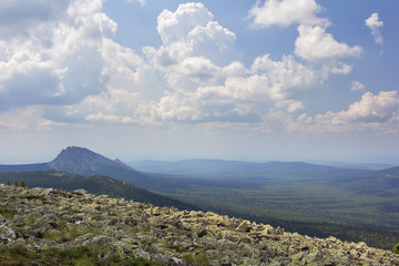 Fototapeta na wymiar Panoramic view of the mountains and cliffs, South Ural. Summer in the mountains.View from the mountains. The nature of the southern Urals.