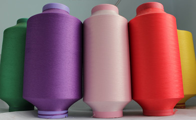 color elastic thread in the production of knitwear - obrazy, fototapety, plakaty
