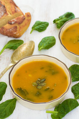 pumpkin vegetable soup with spinach and corn bread