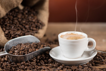 Cup of coffee with coffee beans