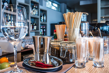 Classic bar counter with bottles in blurred background