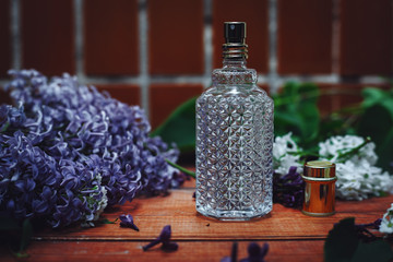 perfume bottle with lilac flowers